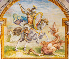 Fototapeta na wymiar GENOVA, ITALY - MARCH 7, 2023: The fresco of St. George on the facade of St. George palace originaly by renaissance painter Lazzaro Tavarone and restored in 1914 by Lodovicom Pogliaghi.