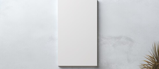 Top view empty white rectangular poster mockup with shadow on light grey concrete wall