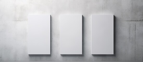 Top view empty white rectangular poster mockup with shadow on light grey concrete wall