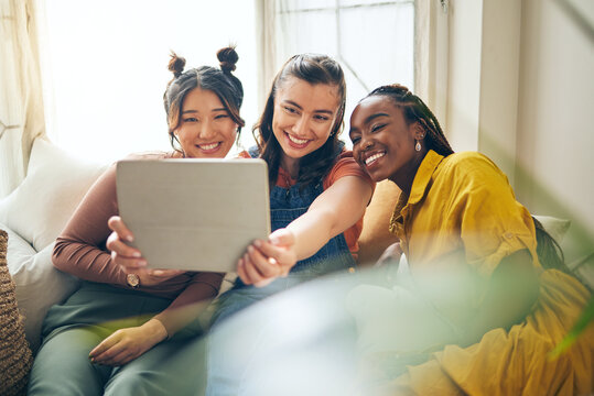 Home, friends with selfie and women with tablet, social media and blog with profile picture. Female people, technology and group on a couch, bonding and influencer with happiness and content creator