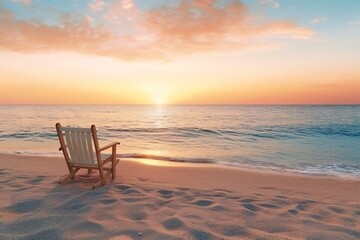 Deckchair on the sandy beach at sunset. Beautiful seascape at sunset. Panoramic view of the sea and sandy beach. Beautyful background. Sea wave with foam. Beautiful ocean waves. 