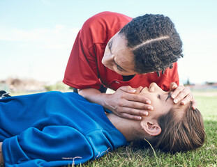 CPR, breathing check and saving woman on field for sport, fitness and game with accident and emergency. Training, paramedic and listening to lungs for breathe from injury with first aid and athlete