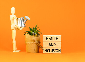 Health and inclusion symbol. Concept words Health and inclusion on wooden block. Beautiful orange...