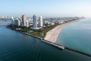 Fototapeta na wymiar Aerial view of South Beach and South Pointe Park in Miami Beach, Florida at sunrise on calm clear summer morning.
