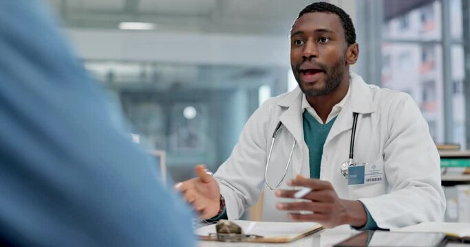Black man, doctor and consulting patient at hospital for checkup, appointment or consultation. African male person, medical or healthcare professional talking to client for life insurance at clinic