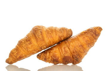 Two fragrant croissants with chocolate filling, close-up, isolated on white.