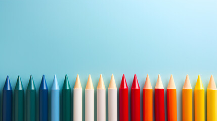 Row of colorful pencils on blue background. Back to school concept