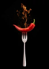 Fototapeten Red hot chili peppers on fire © Muhabbat