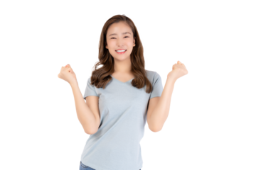 Rejoices at success Portrait happy young Asian woman celebrating success isolated over pastel light blue background Portrait joyful happy making fist pump Smiling lady excited celebrating victory