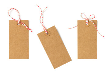 set / collection of three brown natural craft kraft paper hang tags, price tags or gift tags with striped red and white baker's twine, isolated design elements, different positions, PNG - obrazy, fototapety, plakaty