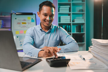 business man working late at night use laptop at desk Happy male portrait working IT, face and male...