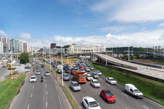 Salvador, Bahia, Brazil - August 11, 2023: Traffic movement of cars, buses and motorcycles near the Raul Seixas viaduct on Avenida Tancredo Neves