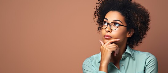 Confused young black woman reflecting deeply on business concept seeking clarity and inspiration