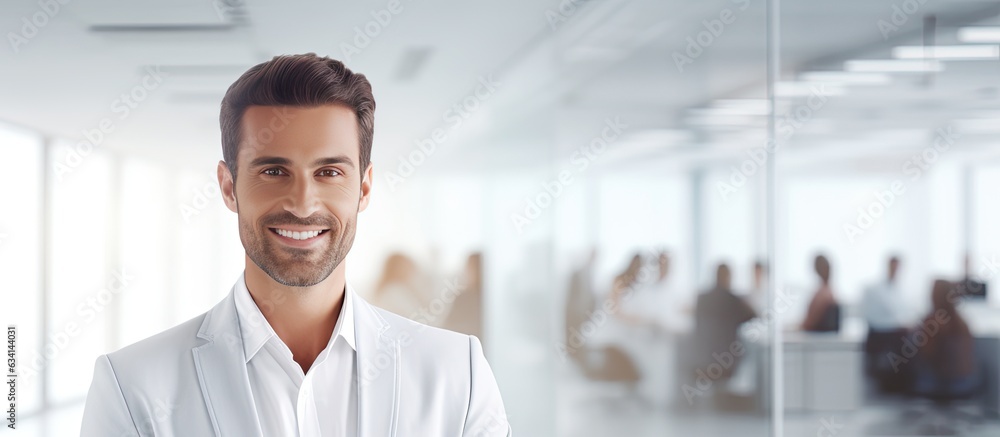 Poster smiling businessman in modern office with text space