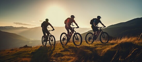 Three friends on electric bicycles enjoying a scenic ride through beautiful mountains