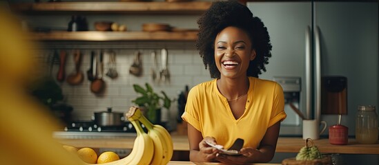 A black woman films a cooking video while happily cutting bananas in her kitchen