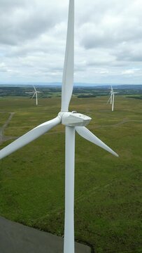 Vertical aerial drone footage of wind turbines in South Lanarkshire, Scotland, UK