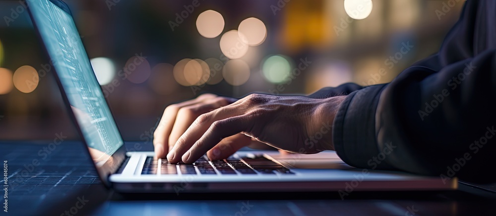 Leinwandbilder young man using laptop at night with blurred bokeh background horizontal image size with space for t
