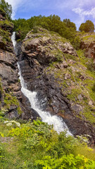 panorama of summer mountains with waterfalls