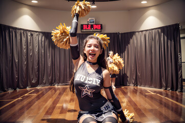 Fototapeta premium Cheerleader girl is cheering and smiling. Generative AI