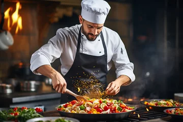Foto op Plexiglas Male chef preparing vegetable vegetarian dish at a professional kitchen. © colnihko