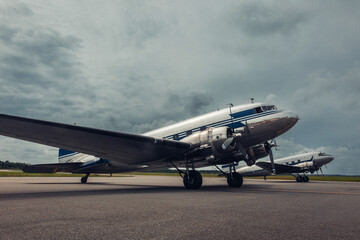 Fototapeta na wymiar Old vintage classic passenger airplane at the runway 