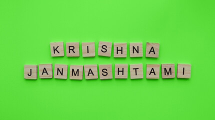 September 6, Krishna Janmashtami, a minimalistic banner with an inscription in wooden letters