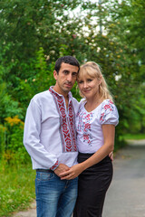 Fototapeta premium Ukrainian man and woman in vyshyvanka. Selective focus.