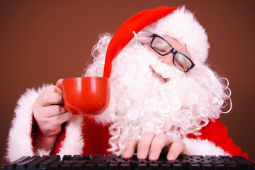 Funny Santa Claus reads online mail. Different emotions.