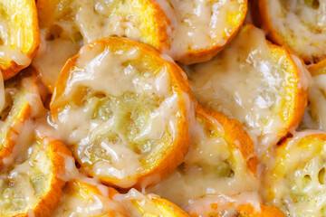 Zucchini yellow baked slices with cheese, close-up, selective focus