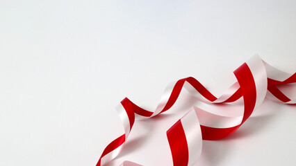 Red and white ribbons with empty copy space on white background. Indonesia Independence Day concept