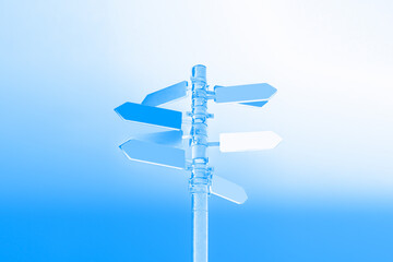 Guidepost with arrows illuminated by a beautiful blue light