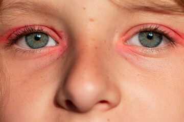 gray-green eyes of a girl close-up with pink make-up. Style and fashion