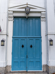 A blue door of a church. 