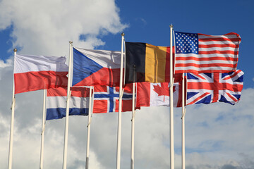 International flags waving atop of their poles