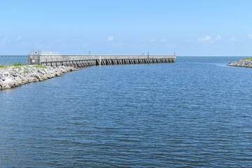 Fototapeta na wymiar Breakwater and Rip Rap Protecting Pumping Station Outlet on Lake Pontchartrain in Metairie, Louisiana, USA