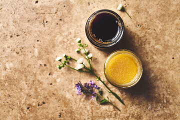 Two glasses of organic natural honey. Multifloral and buckwheat honey. Healthy food ingredients. Copy space