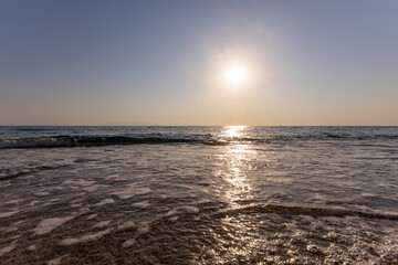 Fototapeta premium a sunset on the sea beach