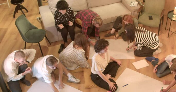 Improved self-awareness Drawings help participants gain deeper understanding their strengths weaknesses. Psychologist woman motivates participants psychological training to be active.