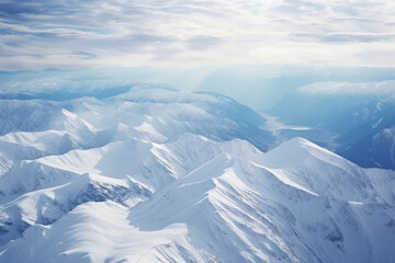 Fototapeta na wymiar Majestic Winter Wonderland: Aerial View of Snow-Capped Peaks Glistening under the Sunlight