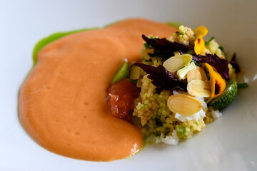 Exquisite dish of modern French haute cuisine prepared with fresh organic ingredients from restaurant own garden and farm and beautifully served