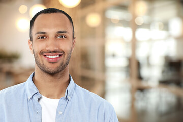 Fototapeta premium Portrait of handsome confident man in office, space for text