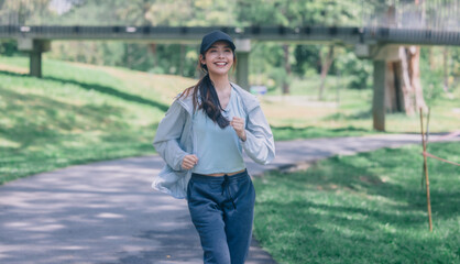 Stylish female runners in modern attire, discover serenity. Reenergize amid jogging the parkway.