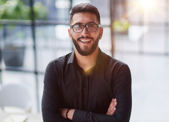 Portrait of smiling young businessman in office