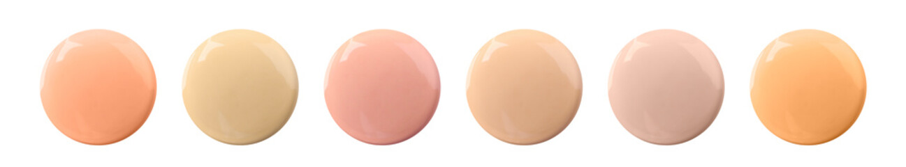 Liquid foundation of various shades for different skin tones isolated on white, top view. Set of samples