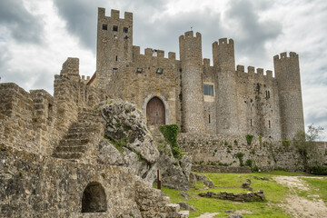 Fototapeta na wymiar Castle of Obidos, a medieval fortified village at cloudy day in Portugal