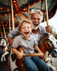 Cercles muraux Parc dattractions In the summertime joy, a senior man and his grandson relish a carousel ride, embodying happiness and togetherness in the midst of fun.