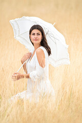 pretty woman summery with umbrella and white dress