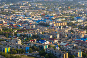 Naklejka premium Morning cityscape. Top view of the buildings and streets of the city. Residential urban areas at sunrise. Beautiful aerial city landscape. Petropavlovsk-Kamchatsky, Kamchatka Krai, Far East of Russia.