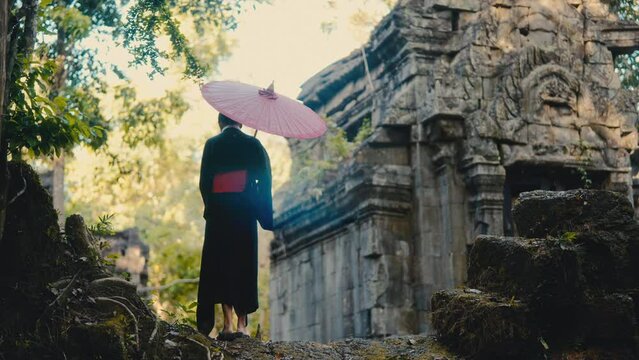 Woman Standing At The Temple In Black Kimono